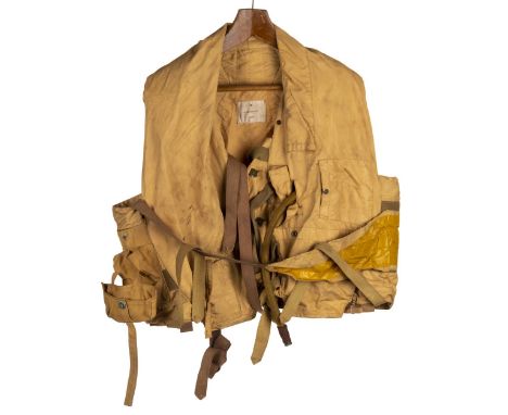 * WWII RAF ‘Mae West’ pilots inflatable life jacket vest. Circa 1940s, of segmented cotton construction with webbing straps &