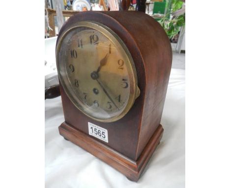 A domed top mantel clock. In working order.