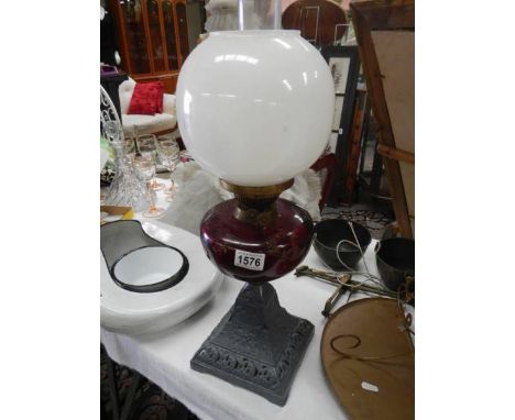 An old oil lamp with ruby glass font, COLLECT ONLY.