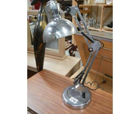 A chrome adjustable table lamp.