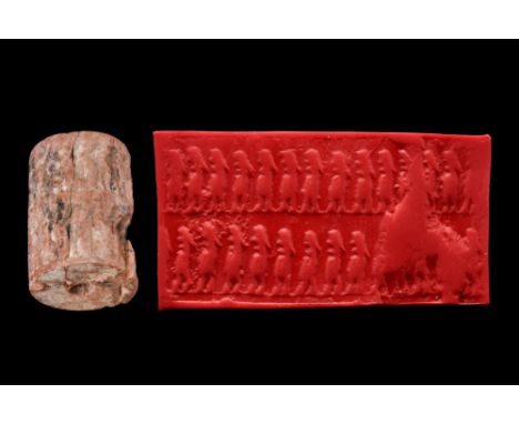 ca. 1500-1000 BC. Western Asiatic bone cylinder seal. Two registers of standing figures facing left, 16 in the top row, 14 in