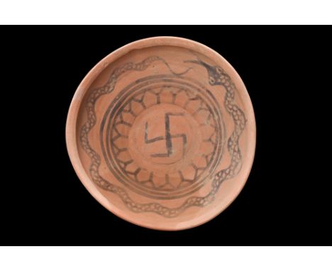 Ca. 3000-2000 BC. A terracotta bowl characterized by its gradual rise from a flat, circular base to a slightly inward-turned 