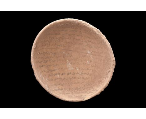 Ca. 600-800 AD. A pottery bowl characterized by a shallow form with a rounded base and a wide basin adorned with intricately 