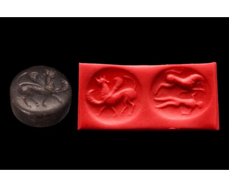 Ca. 2nd millennium BC. A beautiful black double-faced seal from the region of Bactria/Turkmenistan. One side depicts a mythic