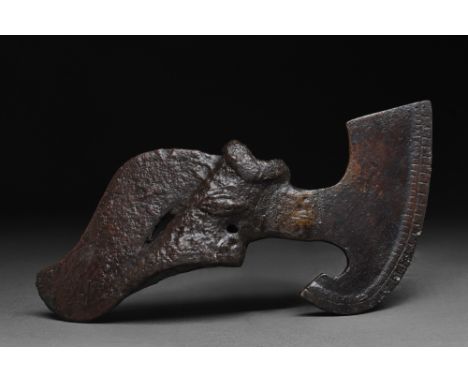 Ca. 1200-700 BC. A cast axe head comprising of a tubular socket with a collar to the upper edge and a wedge-shaped butt. The 