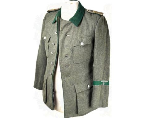 UNIFORMROCK ZOLLSEKRETÄR, (Leutnantsrang), graugrünes Filztuch m. grünem Vorstoß u. Kragen, 4 Taschen, Ärmelband m. Hoheitsad