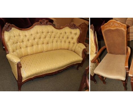 A Victorian style button back settee and cane chair 