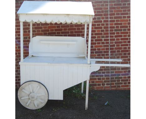 A hand made white painted twin handled Vendor's Cart, in the Victorian taste, height 210cm, length (including handrails) 213c