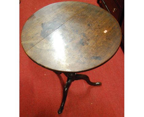 An early 19th century mahogany circular tilt-top pedestal tripod table (currently in two parts), dia. 60cm