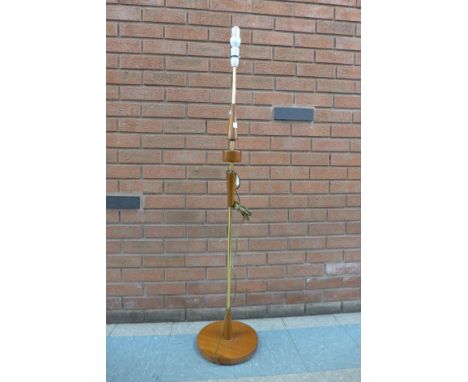 A teak standard lamp 