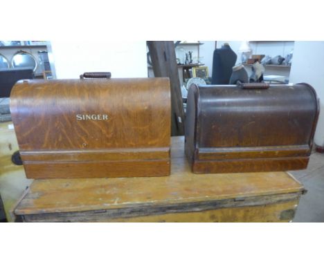 Two vintage cased Singer sewing machines (locked without key ) 