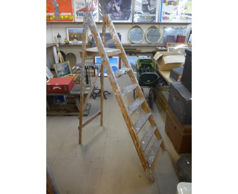 A set of vintage pine stepladders 