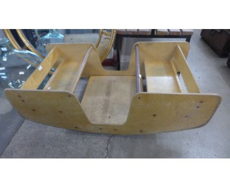 A vintage child's wooden seesaw 