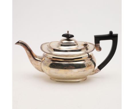 rounded oblong, with a gadrooned border, an ebonised angular handle &amp; a cushion finial, by E.H.P Co. Ltd, Sheffield 1961;