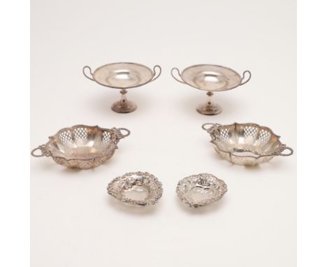 circular form, with twin loop handles, by R &amp; S Garrard &amp; Co, London 1907 together with a matched pair, with ribbon r