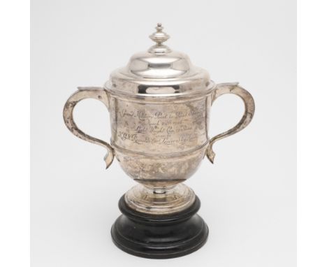 of campana form, with a moulded girdle, a domed foot and the cover with a knop finial, inscribed on one side "21ST LANCERS PO