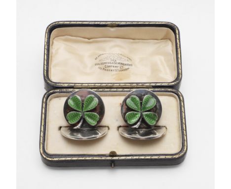 circular and decorated on the front with green guillochÃ© enamel clovers, in original fitted case, by Goldsmiths &amp; Silver