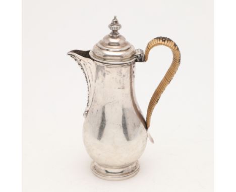 baluster form, with a cane insulated handle and an urn finial, by Peter &amp; Ann Bateman, London 1793; 8.5" (21.5cm) high; 1