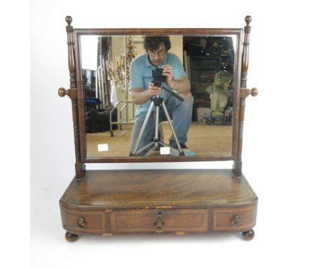 An early 19th century mahogany toilet mirror, with three drawers to base on turned ball feet, h. 69 cm, w. 66 cm, d. 24 cm   