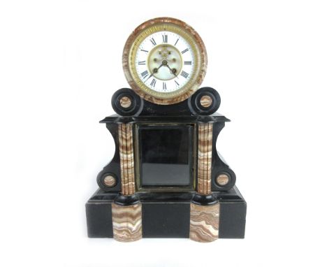 A Victorian mantle clock, the movement striking on a bell, the face with visible escapement and Roman numerals within a slate