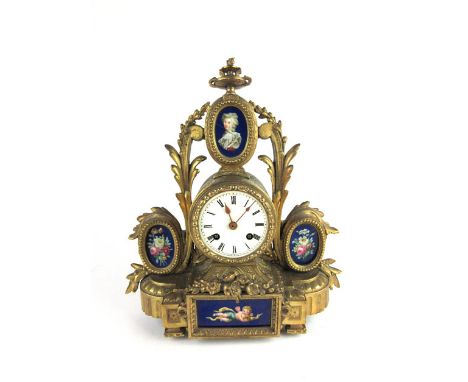 A 19th century French gilt brass and painted ceramic plaque mantle clock with Roman numerals to face, h. 32 cm, w. 30 cm, d. 