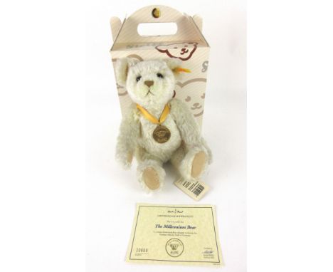 A Steiff original bear 'Millennium Bear' serial No.10608, with blond mohair, and medal with tag in left ear, with certificate