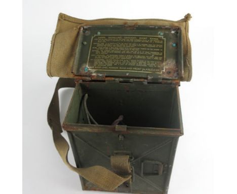 A Second World War Lamp, Signalling Daylight, Short Range signal device, in a green tin case, with canvas double hinged top a