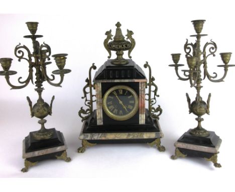 A Victorian clock garniture, the movement striking on a bell, the face with Roman numerals within a slate and marble case of 