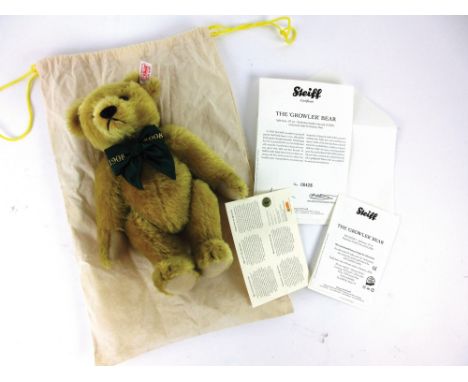 A Steiff original 'Growler' bear with light brass mohair, 1908-2008 anniversary bow tie, tag in left ear, with certificates a