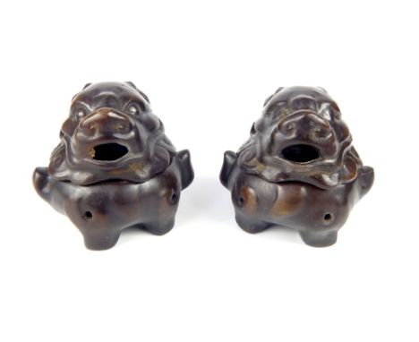 A pair of Chinese bronze incense burners in the form of temple dogs, character stamp to base 'made in Ming Dynasty', 8.5cm h