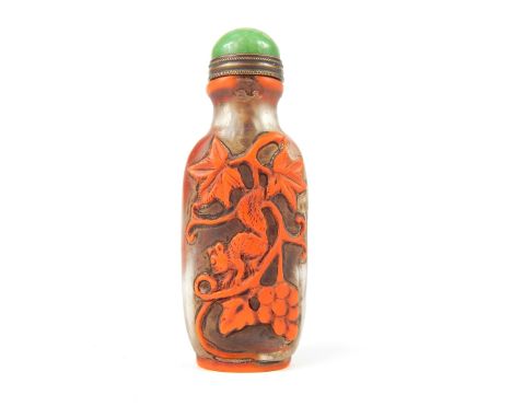 Chinese Peking glass snuff bottle, clear glass with orange overlay decoration of a Squirrel amongst vines & grapes, jade stop
