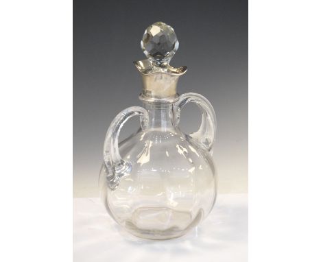 Victorian glass carafe with double lip silver mount, London 1898, sponsors mark of John Grinsell &amp; Sons, 24.5cm high with