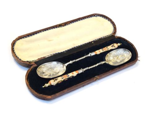 Cased pair of serving spoons, having Derby style handles Condition: General wear with scratches present to the case, light sc