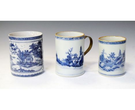 Three Chinese under glaze blue decorated mugs, 13cm high and smaller Condition: All three mugs are missing their original han