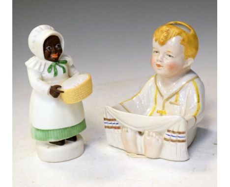 German ceramic wall pocket modelled as a young boy, together with a porcelain nightlight shade, 11cm high and smaller Conditi