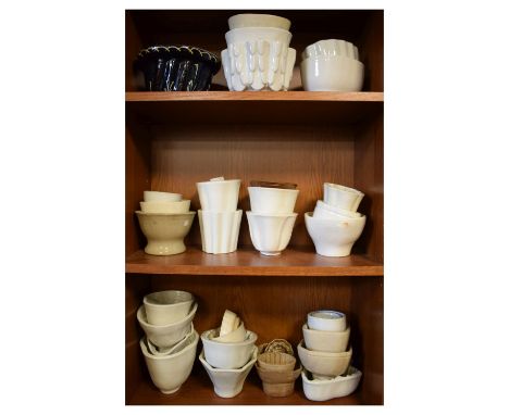 Quantity of jelly moulds of various sizes and designs Condition: Some pieces being chipped and scratched in places, would ben