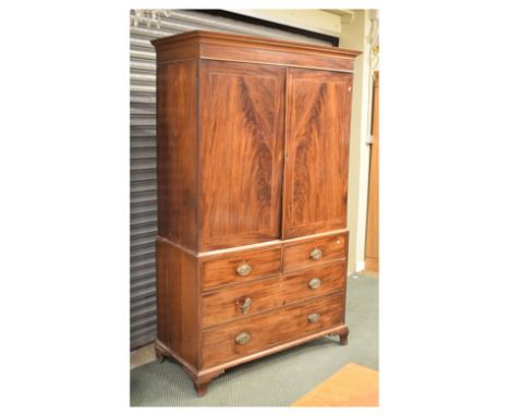 George III mahogany linen press, having two short and two drawers, 201cm high x 118cm wide Condition: In need of restoration,