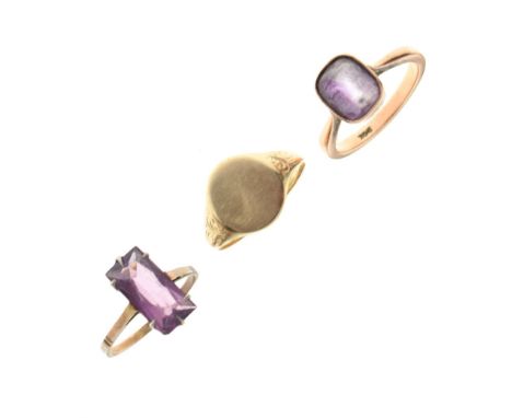 Three various rings comprising unmarked yellow metal signet ring, size K, and two yellow metal rings, each set amethyst-colou