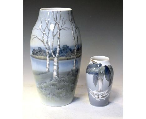 Royal Copenhagen - Tall tapered vase painted with a landscape, together with a smaller vase, 26cm high and smaller Condition: