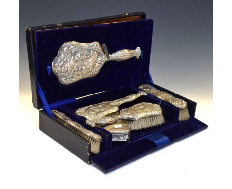 Cased five piece Edward VII silver backed dressing table set of four brushes and one mirror, together with a silver cased tri