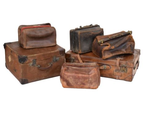 Leather suitcase, together with four Gladstone type bags and a rexine covered trunk Condition: Suitcase with numerous scuffs,