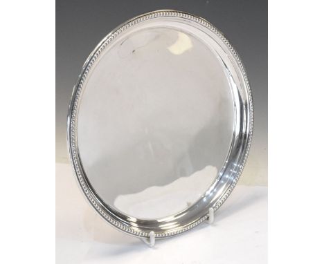 Elizabeth II silver salver with bead decorated edge, Birmingham 1974, 20.5cm diameter, 270g approx Condition: Some light surf