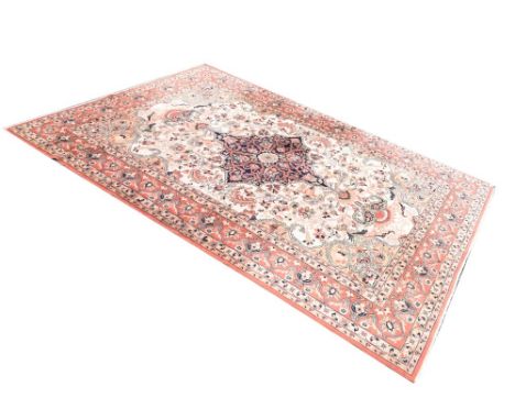 Belgian 'Super Keshan' machine made wool rug, having floral decorative central panel with floral border, on a cream and orang