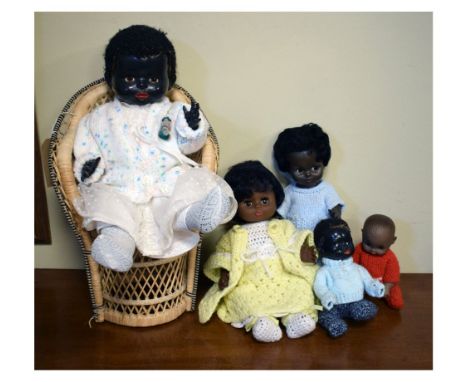 Quantity of vintage black celluloid and rubber headed dolls Condition: Light scratches present on all, with some clothes havi
