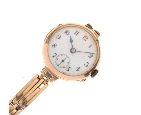 Early to mid 20th Century lady's 9ct gold wristwatch, white Arabic dial with red 12 and subsidiary at 6, unmarked manual wind