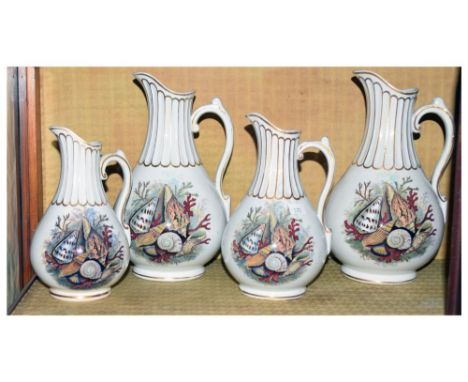 Four Victorian graduated jugs, printed and painted with sea shells and coral, 25cm high and smaller Condition: All jugs with 