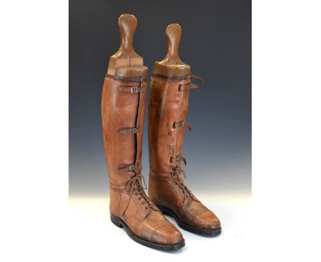 Pair of vintage brown leather riding boots with trees Condition: Scratches and wear to the leather, and discolouration in pla