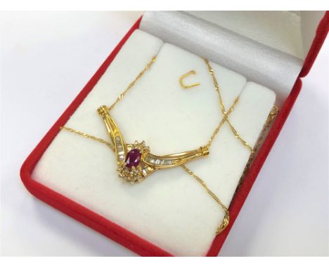 An 18ct yellow gold ruby and diamond set pendant on chain