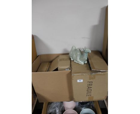 Two boxes of china ornaments and ceramic mugs 