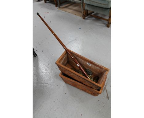 Two terracotta planters together with a walking stick 
